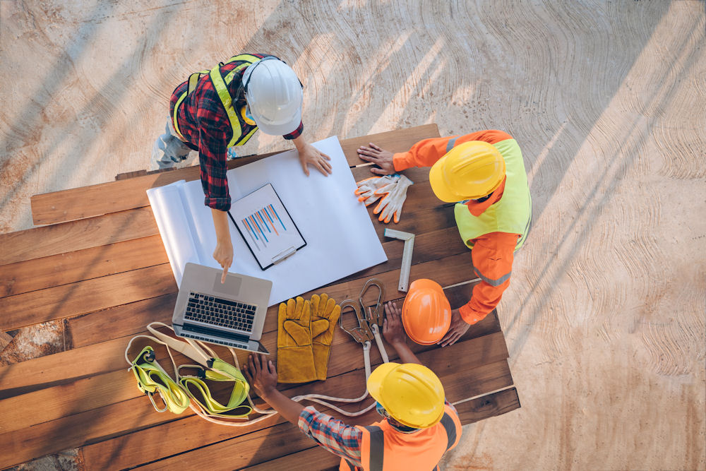 construction team reviewing building plans